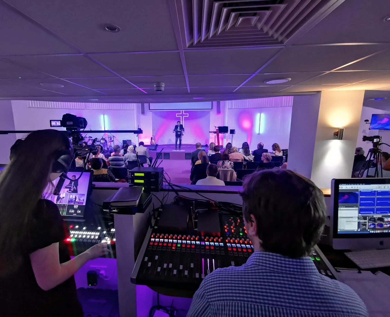 The Cornerstone production team operating the mixing desk and broadcast cameras during a Sunday service