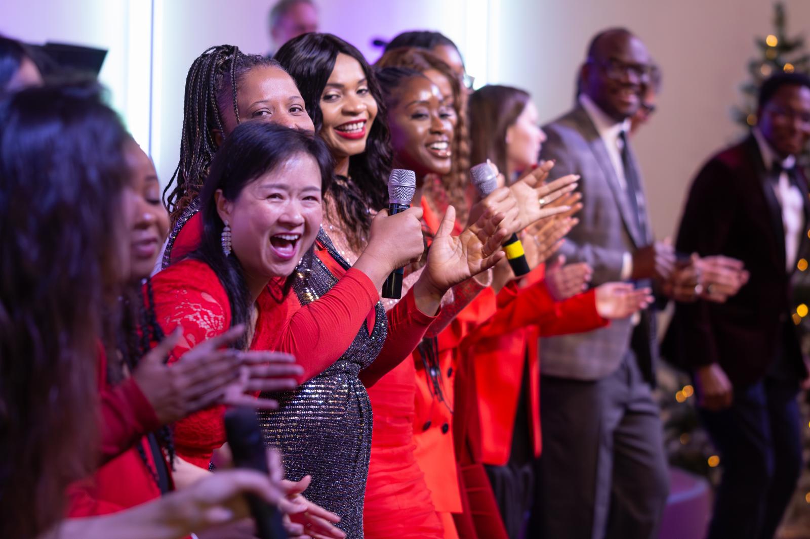 Multicultural worship choir clapping and singing